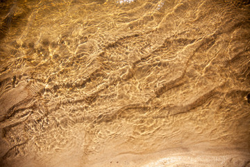 Closeup of beach, water