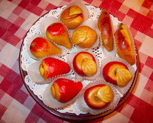 small red cookies on a plate