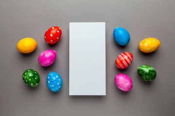 Bright easter eggs with copy space for text on grey background. Retro colorful spring decoration.