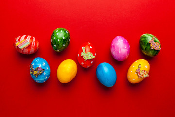 Bright easter eggs with bunny (rabbit) on red background. Retro colorful spring decoration.