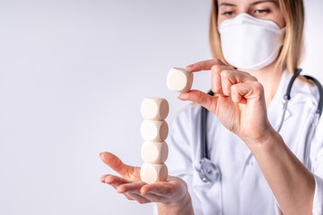 Healthcare concept blank wooden blocks in hand of female doctor copy space