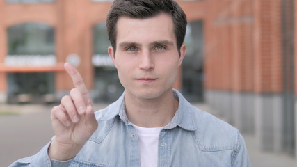 Rejecting Young Man Waving Finger, Outdoor