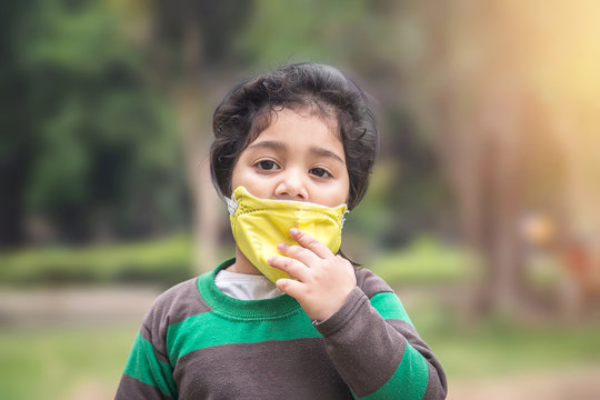 Asian Kid Wearing Facemask During Coronavirus And Flu Outbreak. Virus And Illness Protection