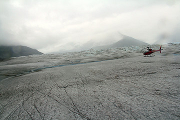 Chopper landing on Glacier in Winter