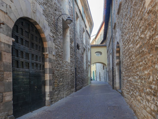   ncient medieval alley with stone buildings in the historic center of a small village in Lombardy