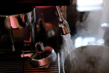 Barista make coffee with coffee machine background