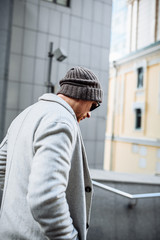 Stylish guy in casual outerwear on the street