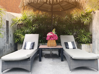 Poolside loungers at an exotic asian hotel.