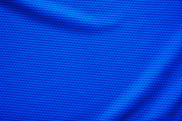 Naklejka premium Blue football jersey clothing fabric texture sports wear background, close up top view
