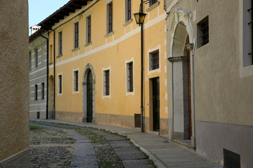 Fototapeta na wymiar Orta San Giulio (NO), Italy - September 02, 2019: A typical small road in Orta San Giulio island, Orta, Novara, Piedmont, Italy