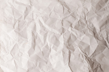 Crumpled white paper background.