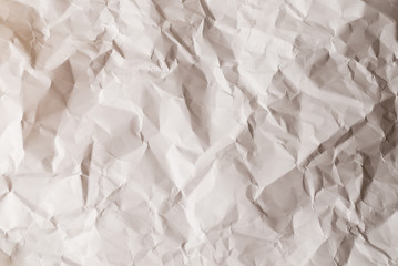 Crumpled white paper background.