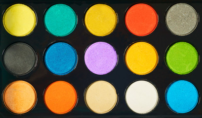 Set of multicolored watercolor paints for creativity.