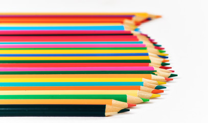 Color pencils lying on a white background.