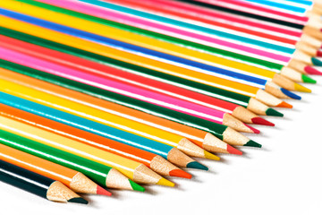 Color pencils lying on a white background.