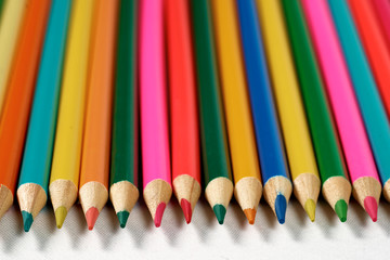 Color pencils lying on a white background.