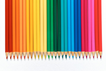 Color pencils lying on a white background.