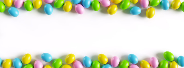 Colorful easter eggs border on white background with a large copy space. 3D render illustration.