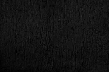 Abstract black background. Black stucco texture. Dark rough surface.