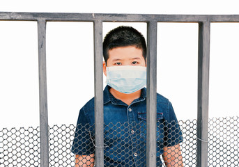 Children wearing sanitary masks confined to the house and isolated white background.