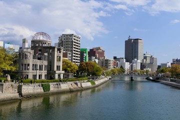 Atomic bomb dome before river with skyline, Hiroshima, Japan