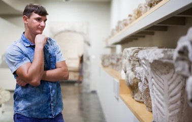 Man looking at exhibits in Ancient Greek hall