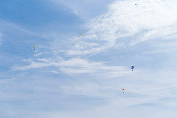 Naklejka na ściany i meble parachuters in the sky