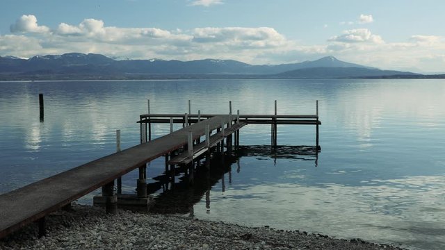 Still view of a pontoon on a quiet lake in Switzerland