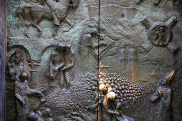 Lubiana / Slovenia - December 8, 2017: Particular of the sculpure on Saint Nicholas churc door in Lubiana, Slovenia