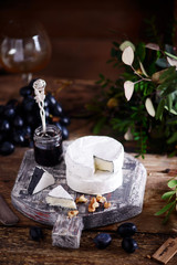 Farmer camembert cheese on the cutting board. selective focus