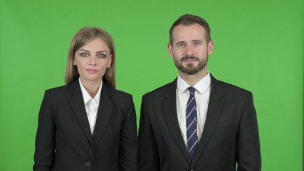 The Smiling Business People Toward Camera Against Chroma Key