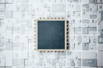 Black computer microchip on dark motherboard.