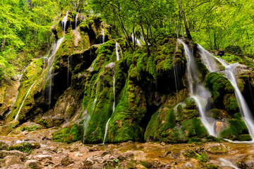 Beautiful Beusnita waterfall in the forest with green moss, Caras Severin county, National Park, Cheile Nerei, Bozovici, Romania