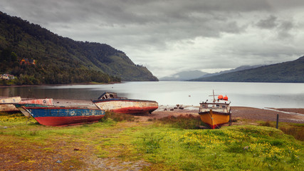 Fishing boats on the beach of Puyuhuapi Fjord, Patagonia, Chile, Pacific Ocean