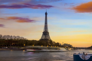 Fototapeta na wymiar Eiffel tower and Seine river in the sunset sky scene.