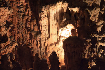 Fototapeta na wymiar Postojna / Slovenia - December 9, 2017: World famous cave Postojna with stalactites and stalagmites, Slovenia
