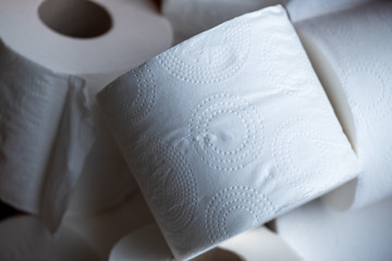 Basket full of white toilet paper, illustrative of hoarding toilet rolls during the corona virus Covid-19 epidemic, March 2020.