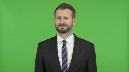 The Smart Businessman doing No Sign by Head against Chroma Key