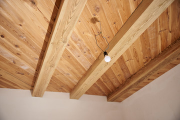 Repair in the apartment / house. Wooden ceiling on wood beams.