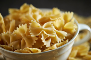 Dried farfalle pasta in cup