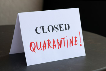 Coronavirus quarantine message, a table with a sign closed. Virus outbreak concept