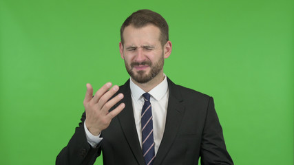 The Ambitious Businessman getting Upset against Chroma Key