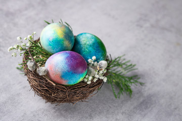 Mystical coloring Easter eggs with twigs and spring flowers