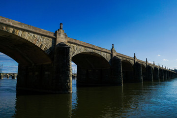 Fototapeta na wymiar Stone arch bridge