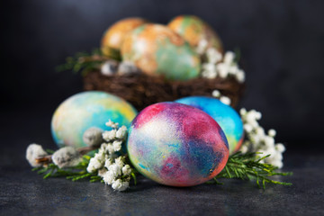 Easter colored eggs with spring flowers