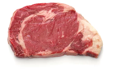 Tuinposter raw rib eye steak isolated on white background © uckyo