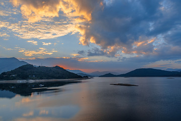 The lake at dusk, rosy clouds all over the sky