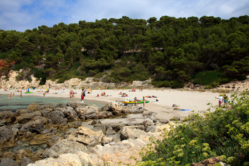 Fototapeta premium Es Migjorn Gran, Menorca / Spain - June 25, 2016: The Escorxada beach and bay, Es Migjorn Gran, Menorca, Balearic Islands, Spain