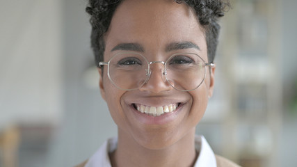 The Portrait of Smiling Young African Girl with glasses
