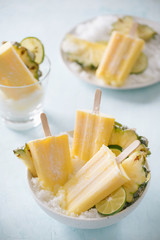 Homemade Pineapple Popsicles on a bowl(selective focus; close-up shot)